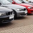 row of prestige used cars for retail sale in a motor dealers yard showing same model in different colour choices