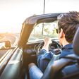 Couple of lovers driving on a convertible car - Newlywed pair on a romantic date