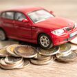 Bangkok, Thailand - January 20, 2022 Car on stack of coins. Car loan, Finance, saving money, insurance and leasing time concepts.
