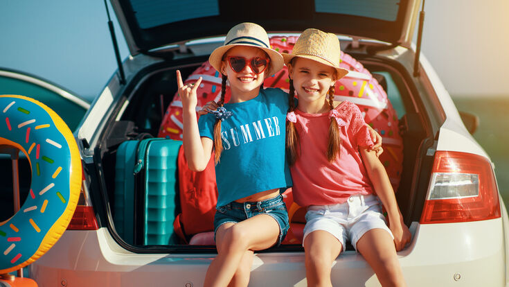© iStock.com/evgenyatamanenko twins female drive pack pretty man life little resort outdoor vehicle caucasian beautiful lifestyle leisure vacation young trip kid girl
