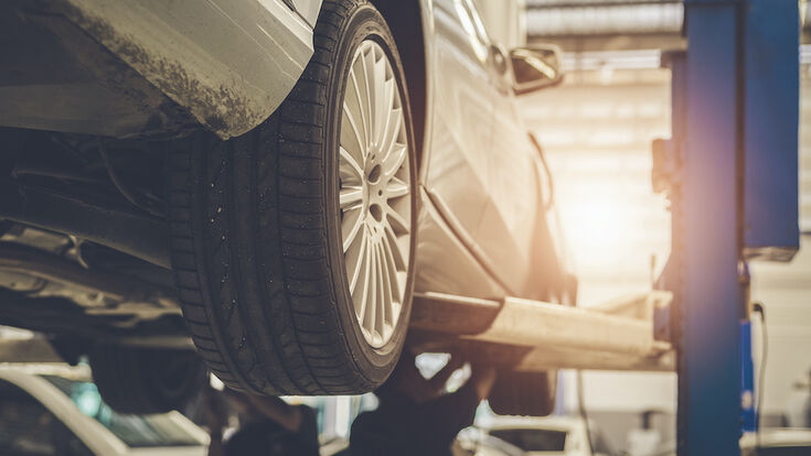 © seksanpk - stock.adobe.com car repair mechanic auto shop automotive service maintenance engine station repairing garage work industry indoors transportation worker tool vehicle working automobile workshop repairman male wrench people lift motor