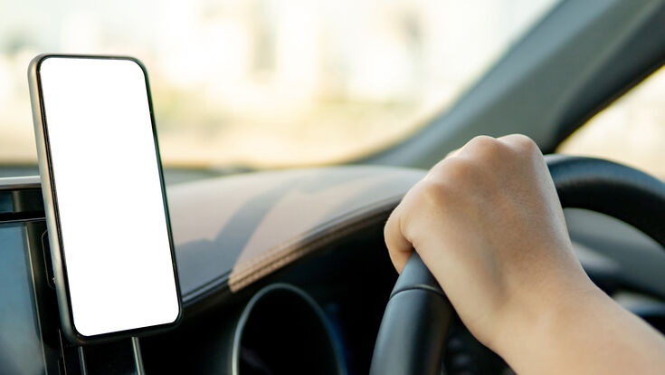 © zephyr_p - stock.adobe.com car smartphone gps mobile navigation phone mount driver technology using assistant map device driving app holding vehicle transport travel holder modern empty blank telephone display transportation location screen road hand charging console smart automobile automotive industry monitor auto traffic safety cellphone steering wheel speed dashboard cellular mockup route interior