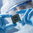 Modern PC biometrics board chip circuit close-up component computer cpu cybersecurity data development device digital electronic electronics equipment factory future futuristic gigafactory hand hardware high tech holding industry information lab laboratory manufacture manufacturing memory microchip microelectronics motherboard nanotech nanotechnology power processor science semiconductor silicon speed support technology upgrade wireless