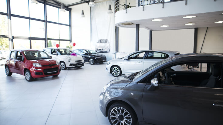 © littlewolf1989 - stock.adobe.com car automobile vehicle dealership showroom brand new interior no people sale automotive car dealer buying selling trade purchase auto deal sell service business key sales keys indoors horizontal dealer people owner bargain leasing transportation retail industry coupe day bright sedan SUV hatchback